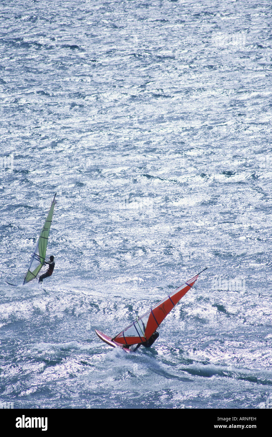 2 (Two) windsurfers with plain ocean background, British Columbia, Canada. Stock Photo