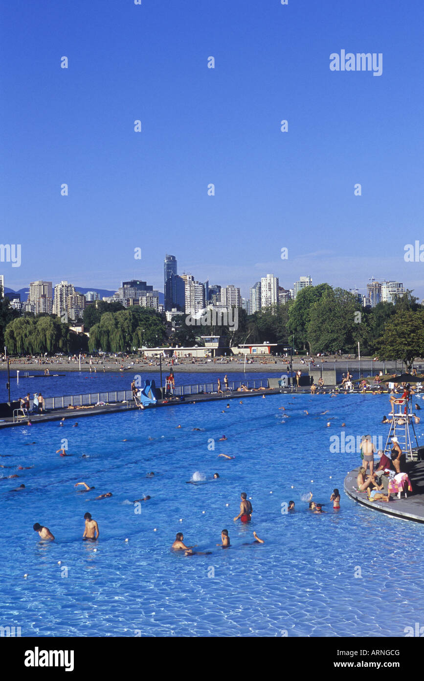 People enjoying the Kitsilano Outdoor Swimming Pool, English Bay and downtown Vancouver beyond, Vancouver, British Columbia, Can Stock Photo