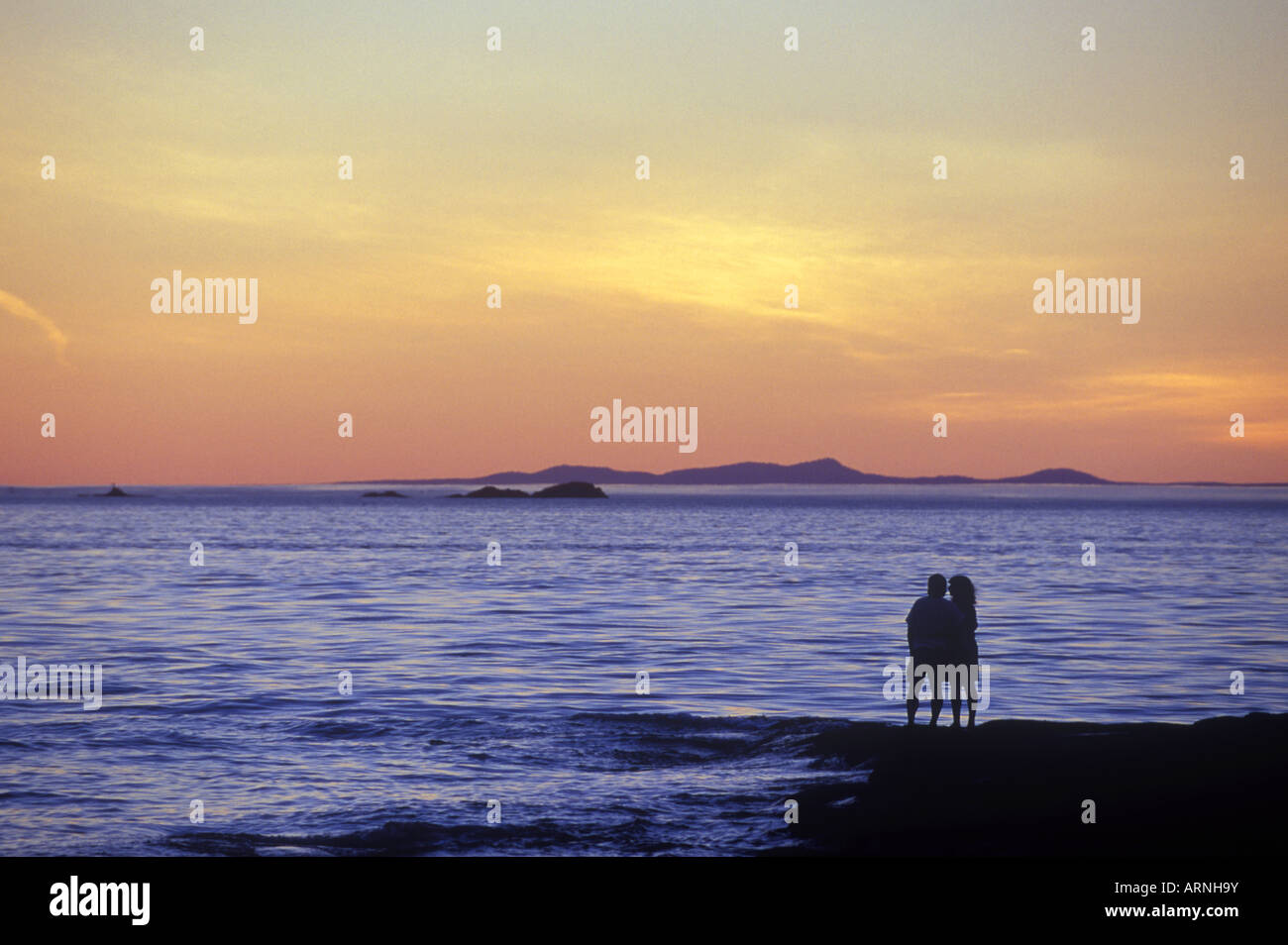 Couple in sillouette at twilight, Malaspina Galleries, Gabriola Island, Vancouver Island, British Columbia, Canada. Stock Photo