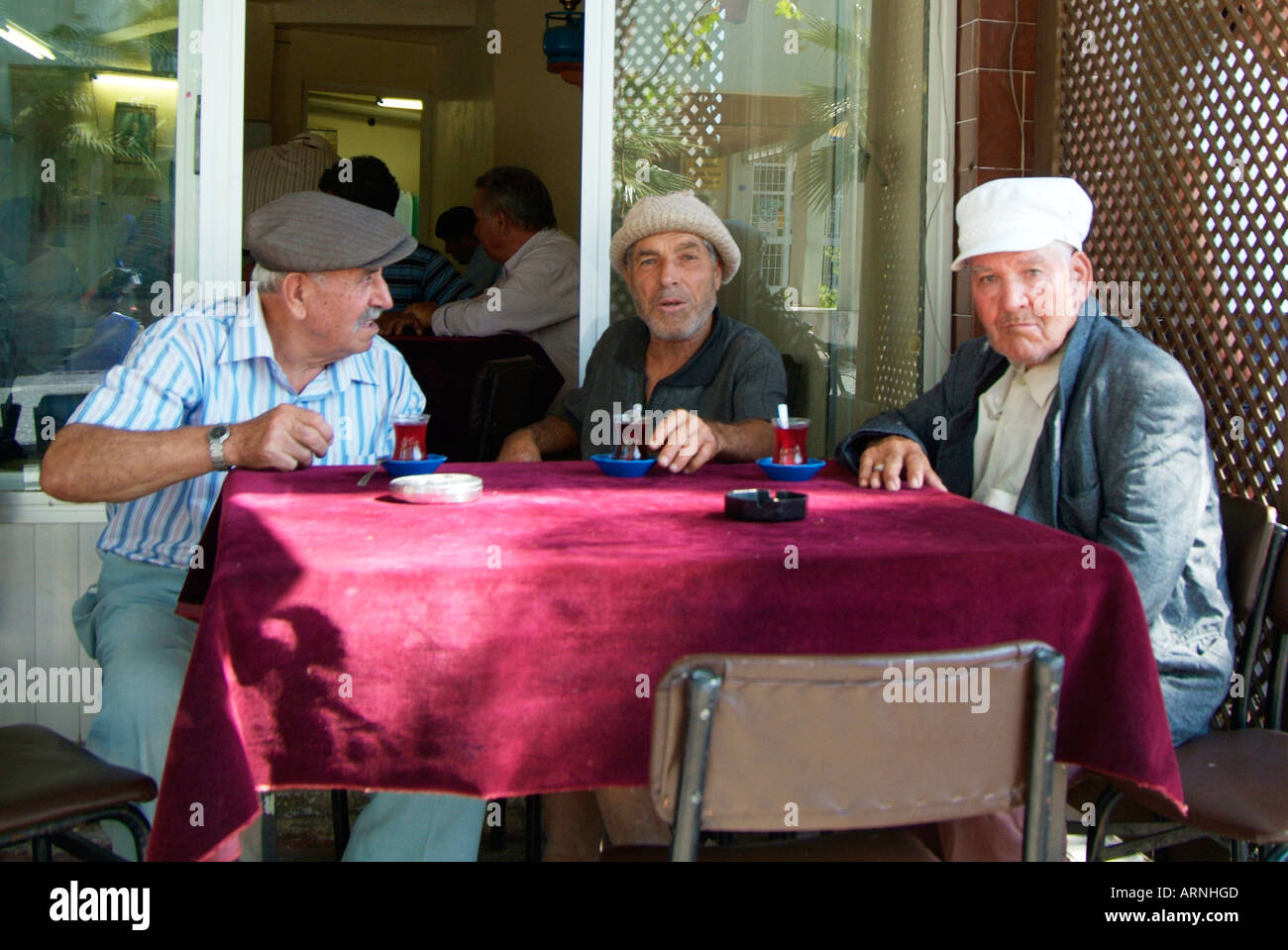 Men old café table talk converse communicate retire pension hat cap  tradition wait rest argue debate Turk Turkey Turkish Stock Photo - Alamy