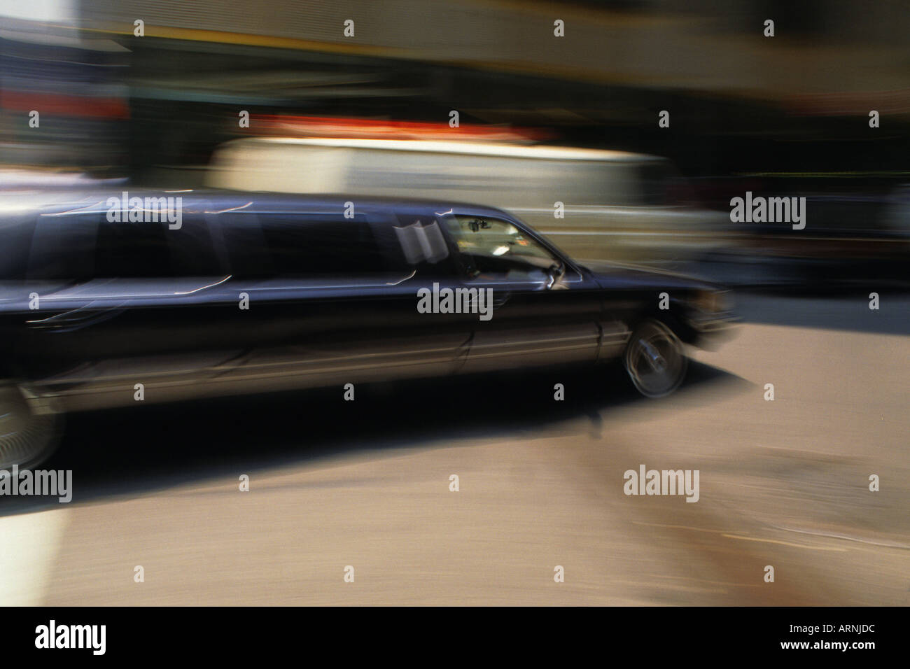 Black Stretch Luxury Car New York City Midtown Manhattan Motion Blurred Fast Life Stock Photo