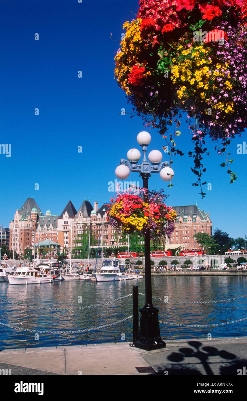 Flower baskets hanging with the Empress Hotel beyond, Victoria