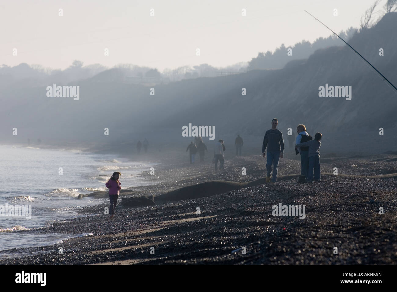 People out enjoying the early spring weather in Dunwich Beach Stock