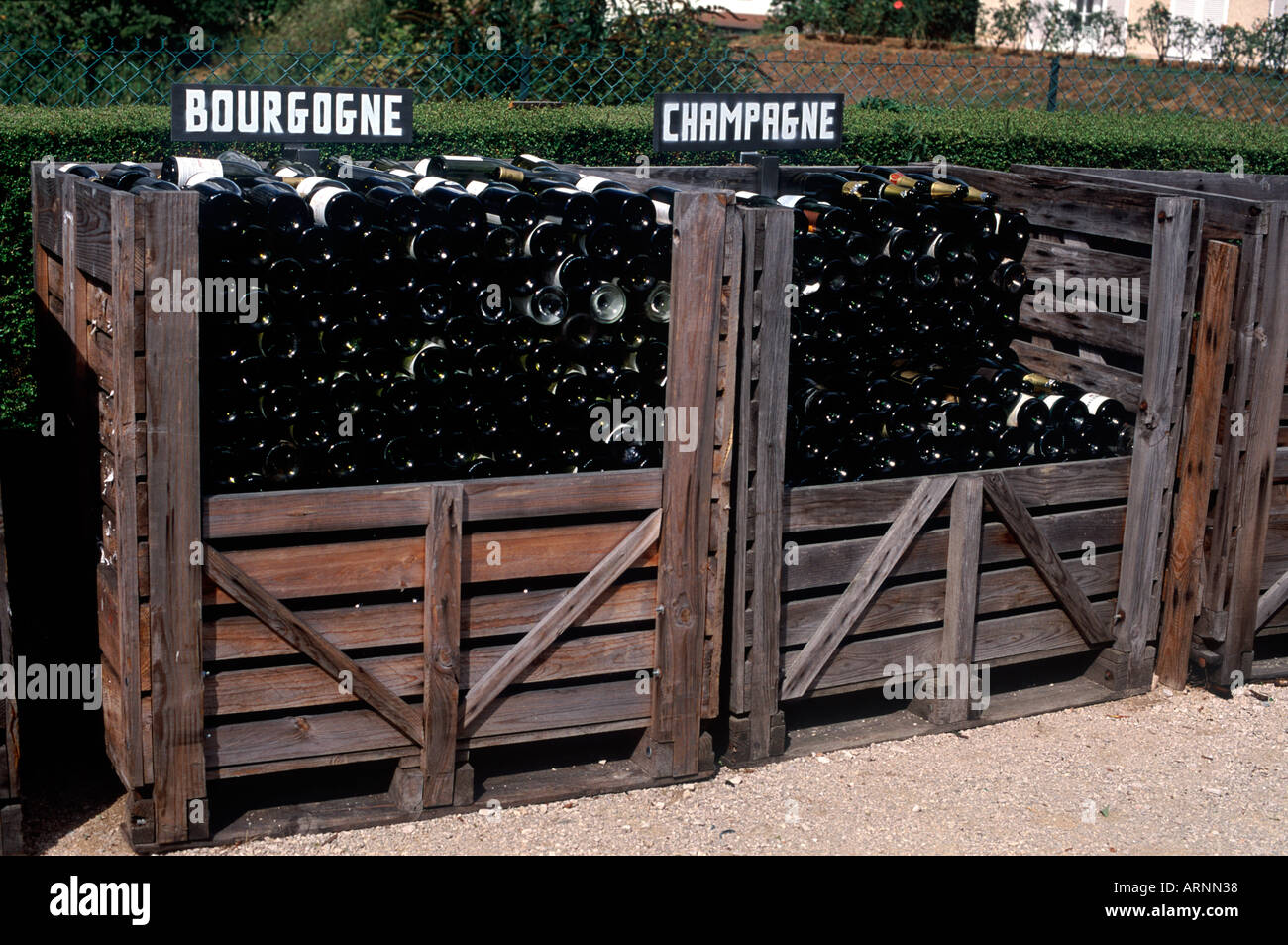 Public wine bottle recycling with separate bins for Burgundy and Champagne bottles, Pernand Vergelesses, Cote de Beaune, France Stock Photo
