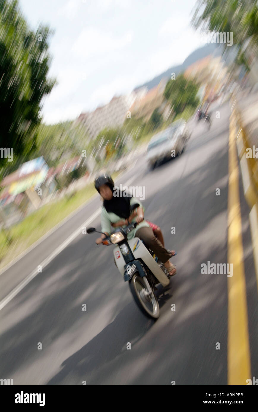 scooter, moped, traveling, at speed, in penang, malayasia, asia, asian, city, garage, repair, fix, service, scooter, moped, in p Stock Photo