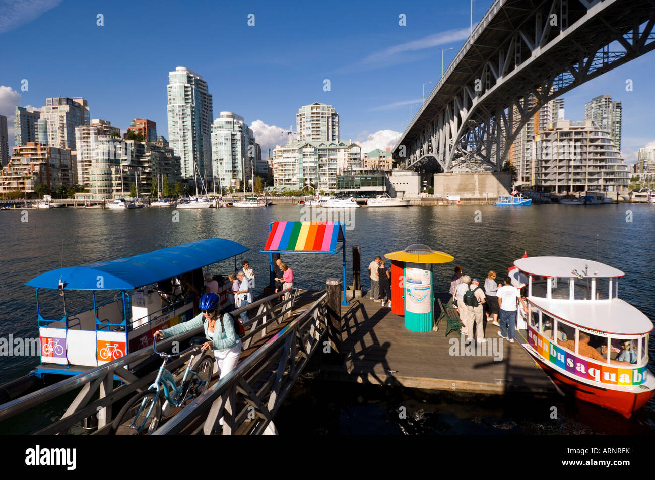 Brightly colored water taxis on False Creek, Vancouver, British