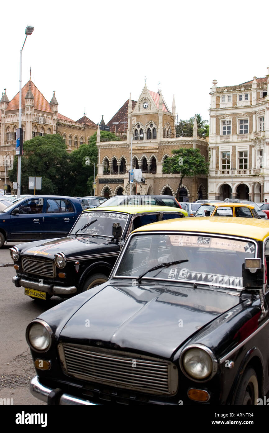 Mumbai, Bombay, India, Asia. David Sassoon Library with Black and Yellow taxis in the foreground. Stock Photo