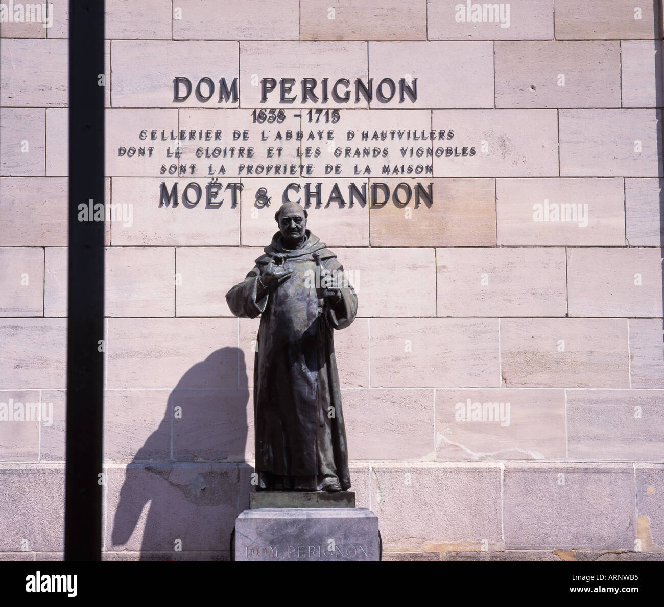 A statue of the monk Dom Perignon the inventor of champagne holding a  bottle in the courtyard of Moet Chandon LVMH group in Epernay France Stock  Photo - Alamy