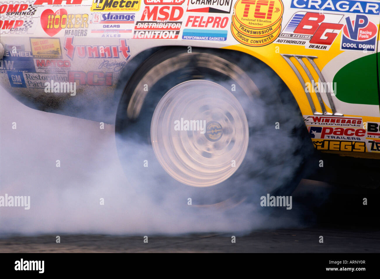 Tire spinning at the start of drag race at the 1997 Mopar Nationals Stock Photo