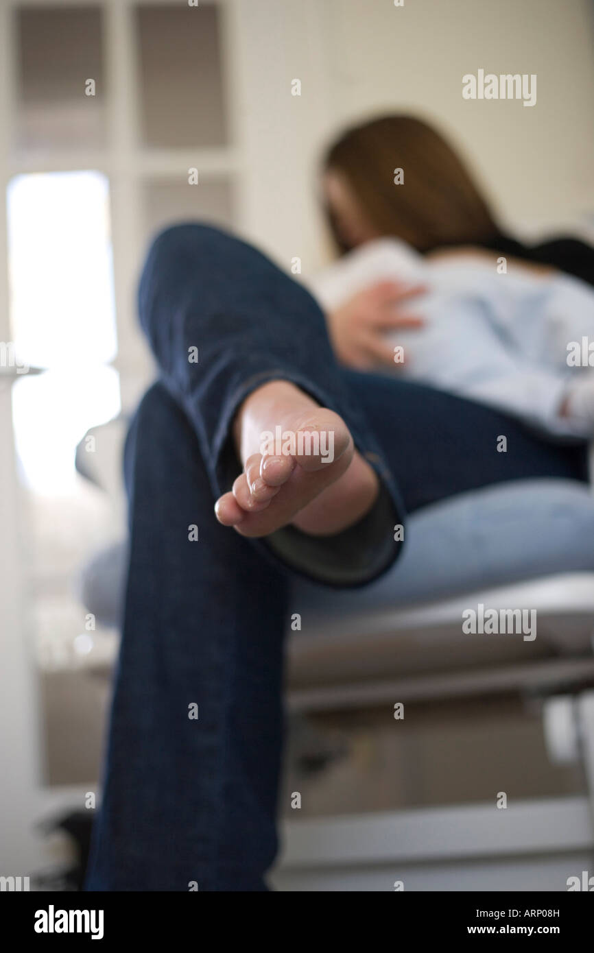 close up of mother's foot as she breastfeeds her baby Stock Photo Alamy