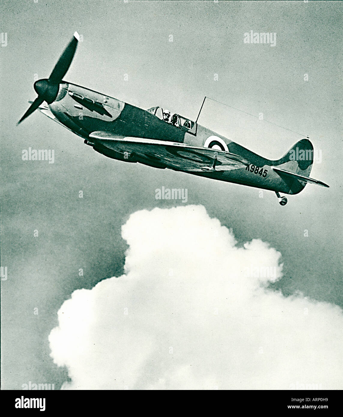 Spitfire 1939 photo of the iconic English fighter plane designed by Reginald Mitchell flying solo Stock Photo