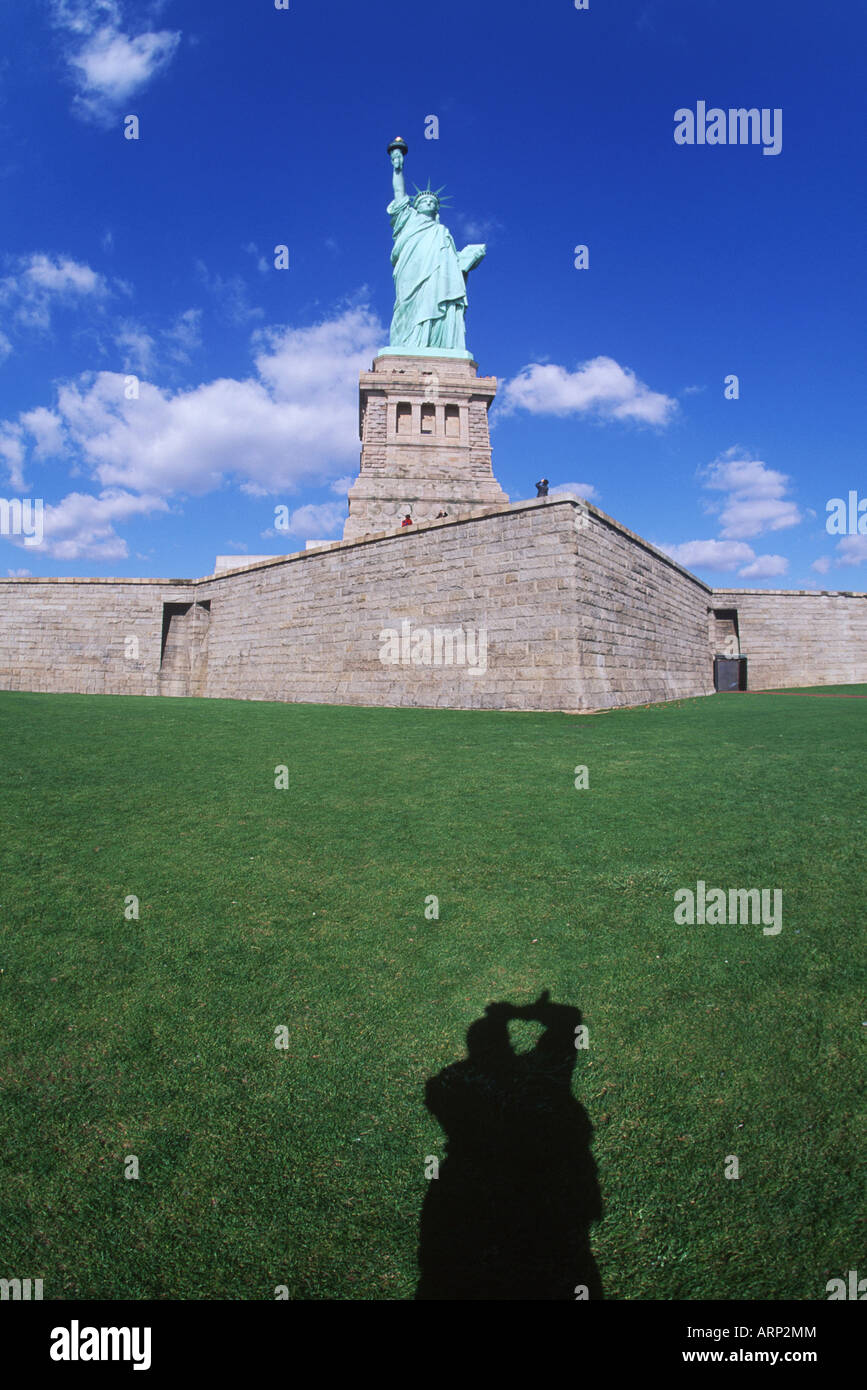 USA, New York City, Statue of Liberty, tourist's  shadow taking photo Stock Photo