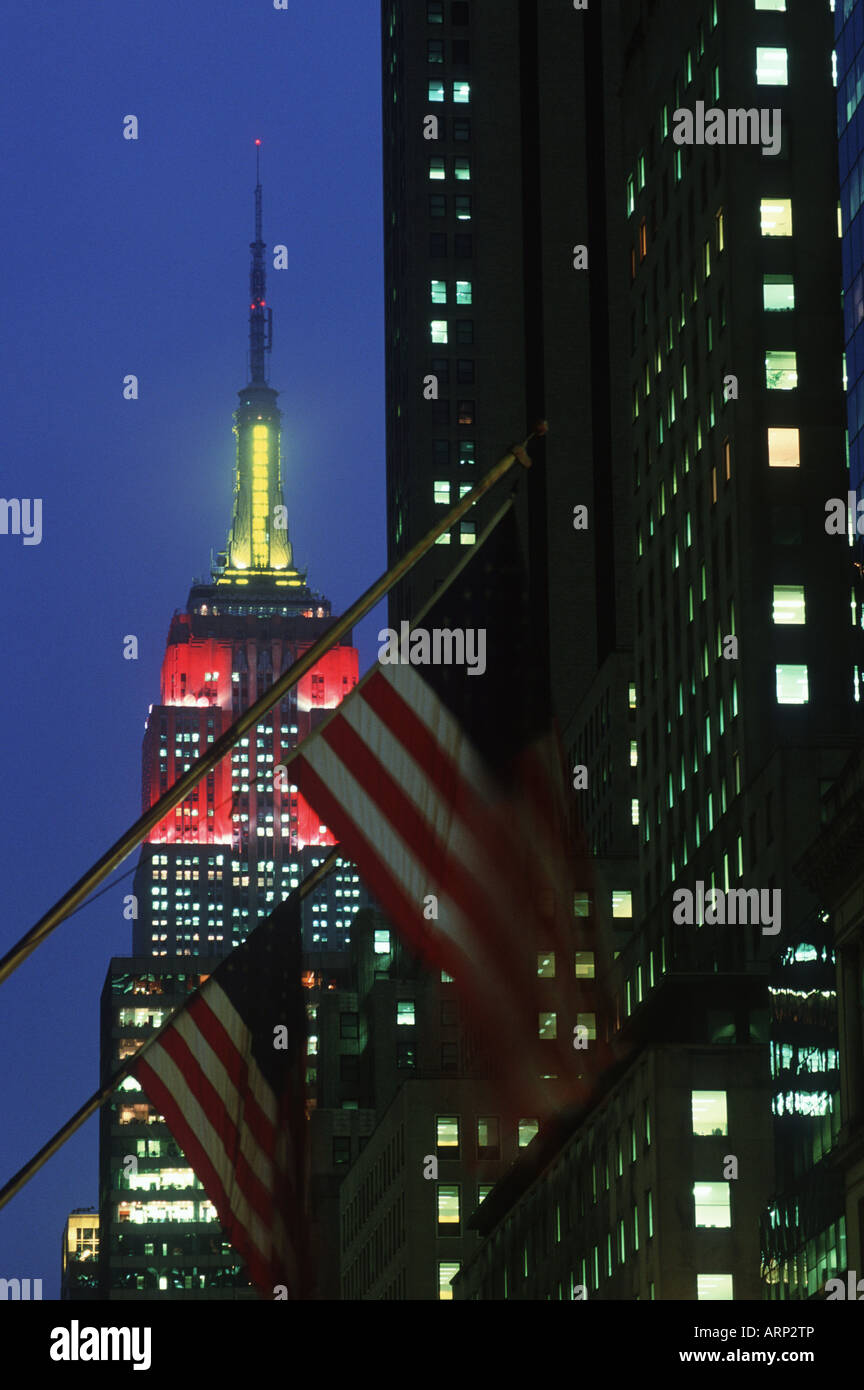 USA, New York City, Empire State Building , with flags at dusk Stock Photo