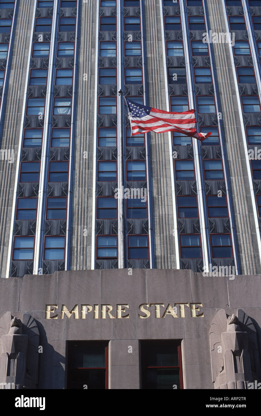 USA, New York City, Empire State Building , with US flag Stock Photo