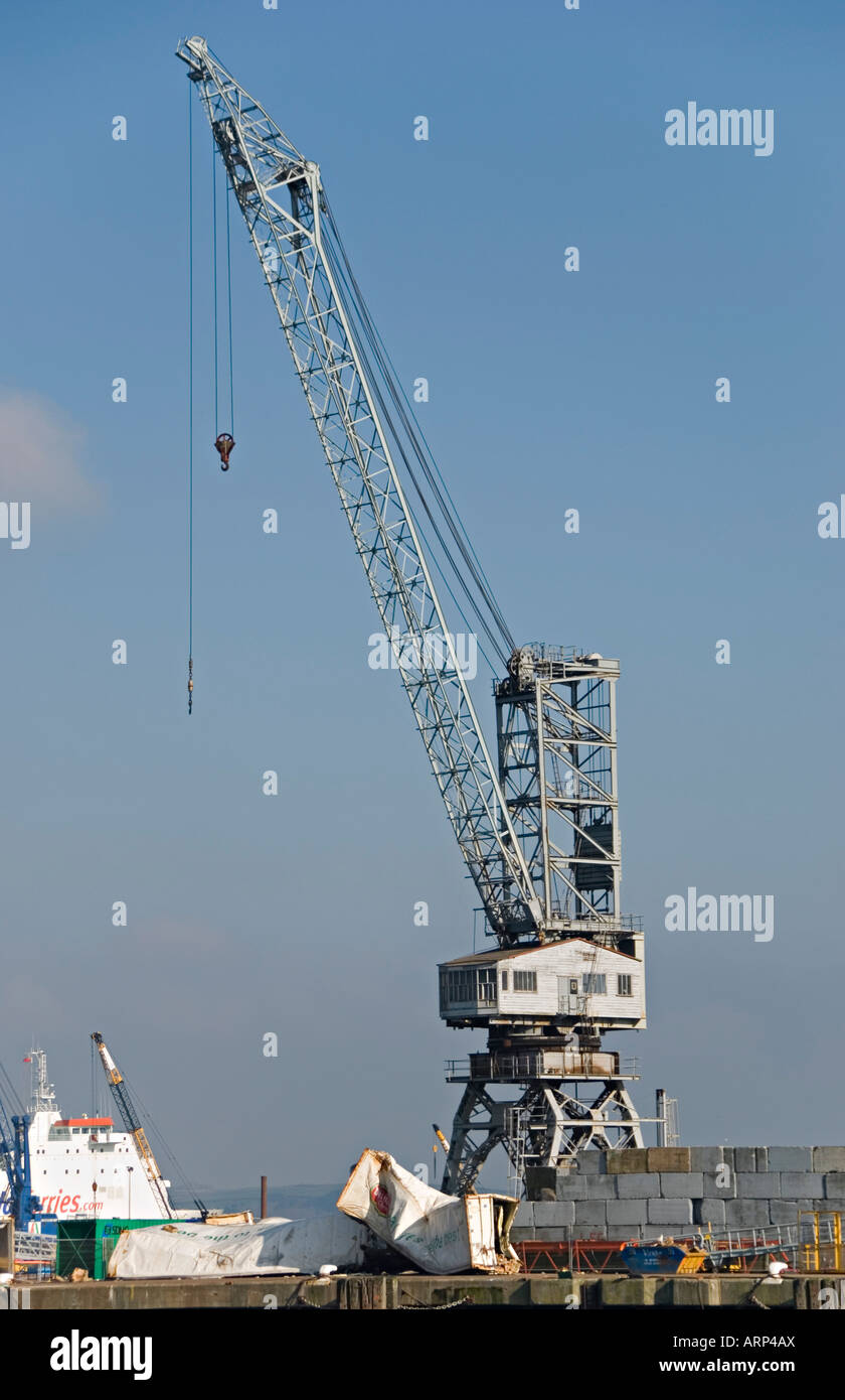 Falmouth Docks, Cornwall, UK. Dockyard crane with dropped shipping container Stock Photo