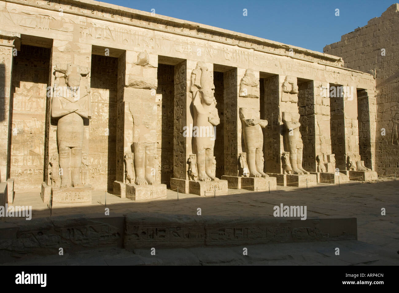 North colonnade with portraits of god Osiris in the first court of temple Medinat Habu West Bank Luxor Nile Valley Egypt Stock Photo