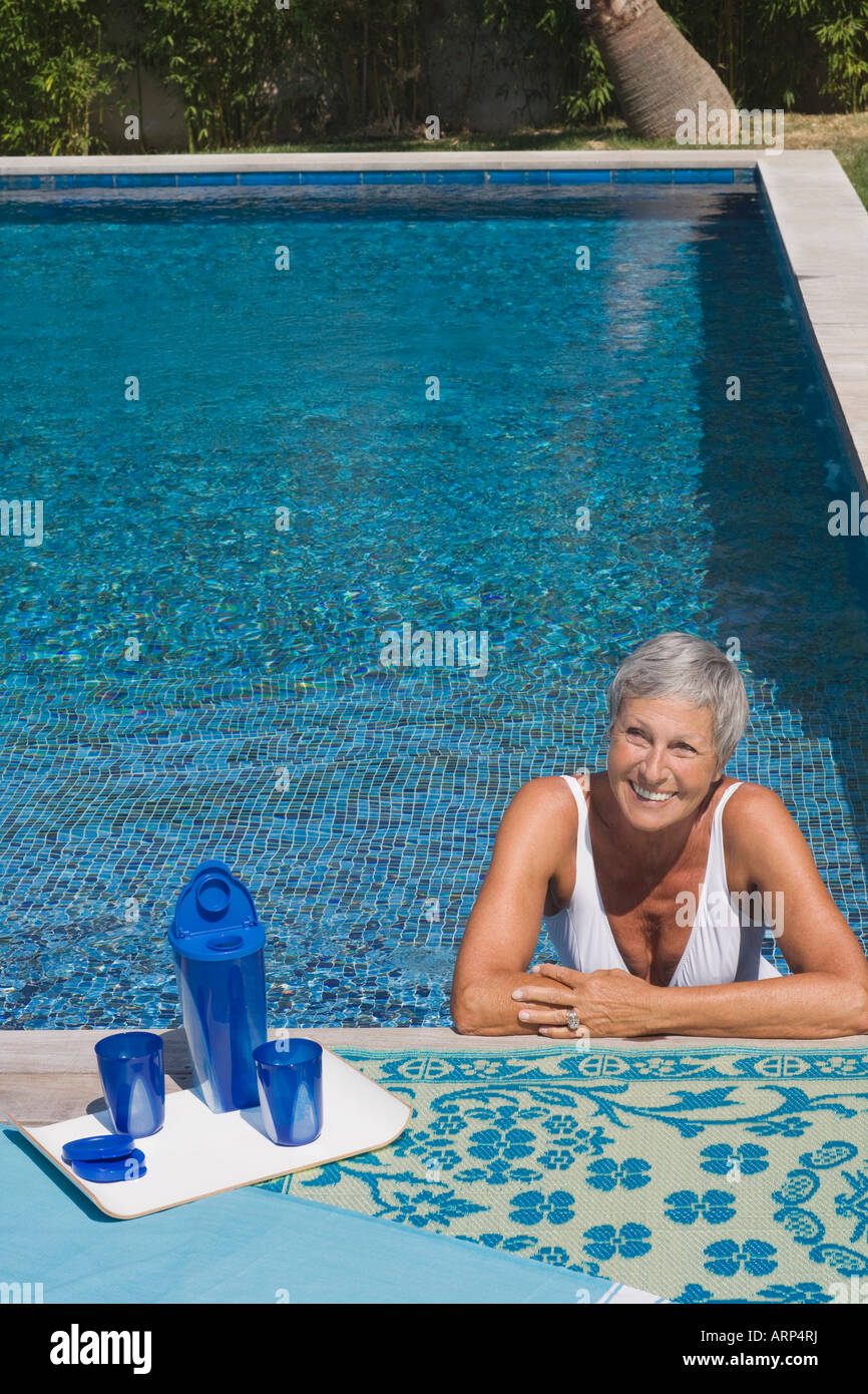 Woman in swimming pool Stock Photo - Alamy
