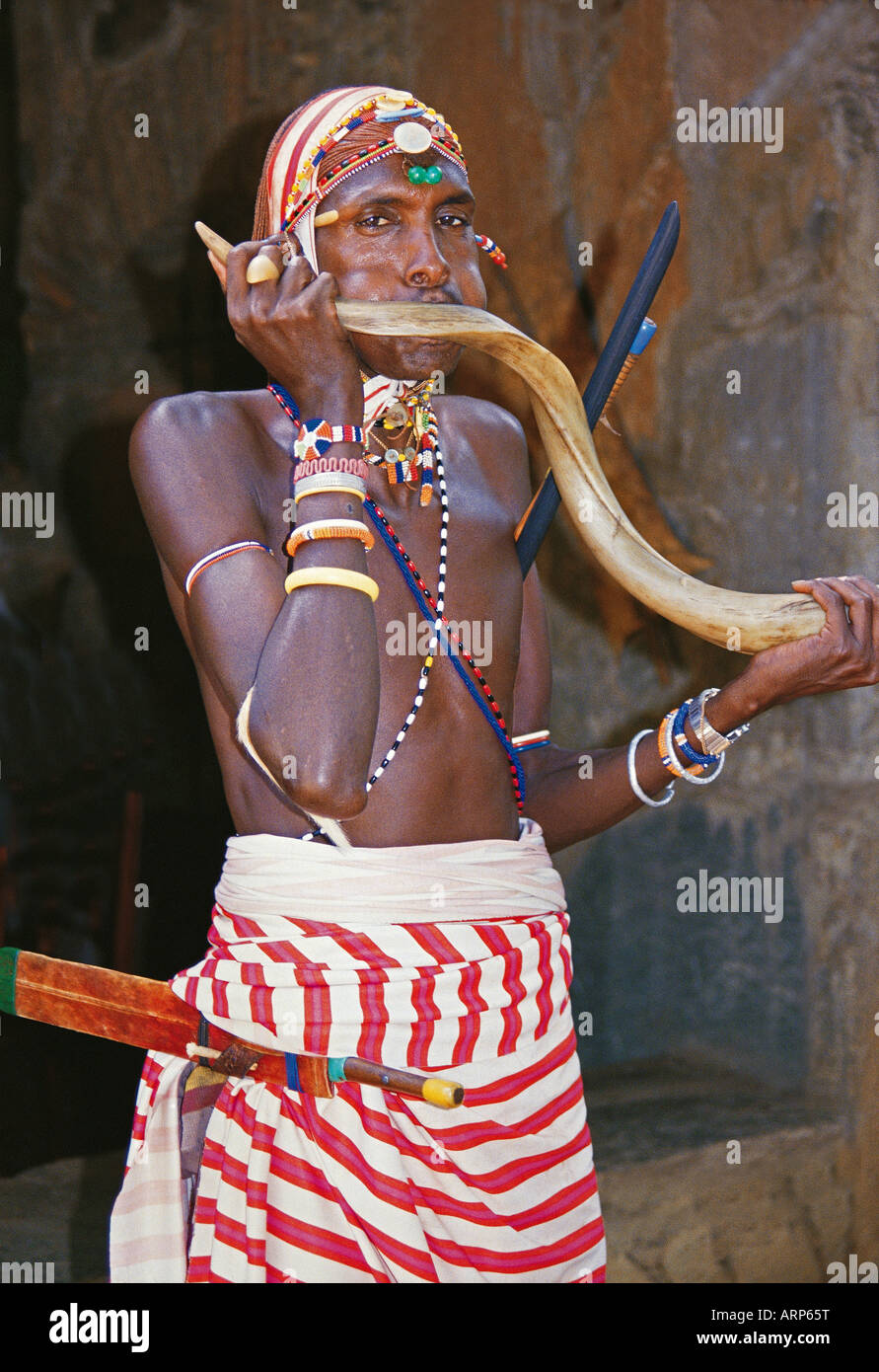 Samburu Moran warrior playing a traditional Kudu horn Samburu National