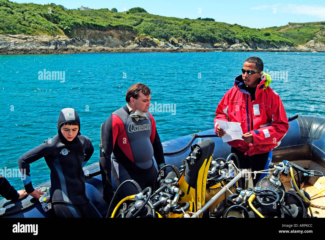 Divers on a boat listening the dive instructions Stock Photo Alamy