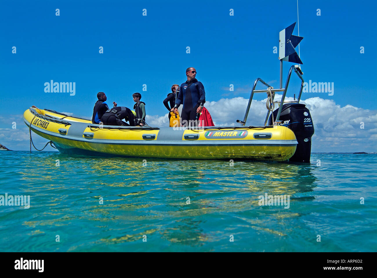 Divers on a inflatable boat Stock Photo - Alamy