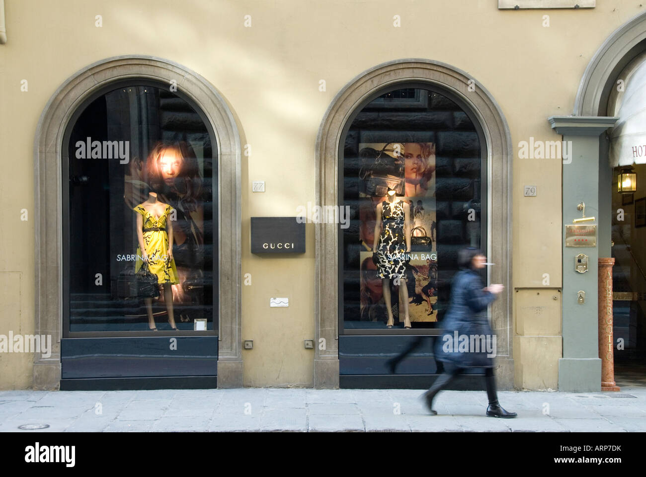 Gucci shop window with woman passing in Via de' Tornabuoni Florence Stock  Photo - Alamy