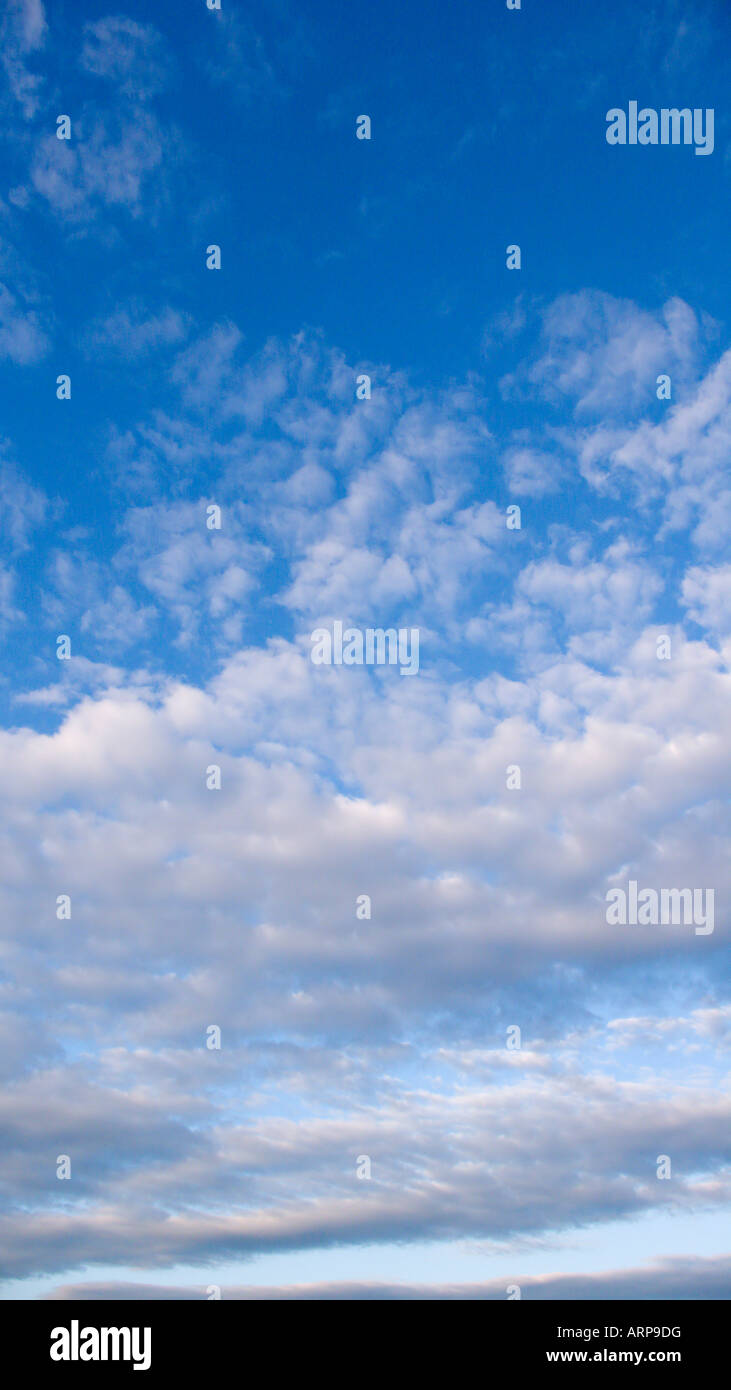 Blue sky with fluffy white clouds Stock Photo - Alamy