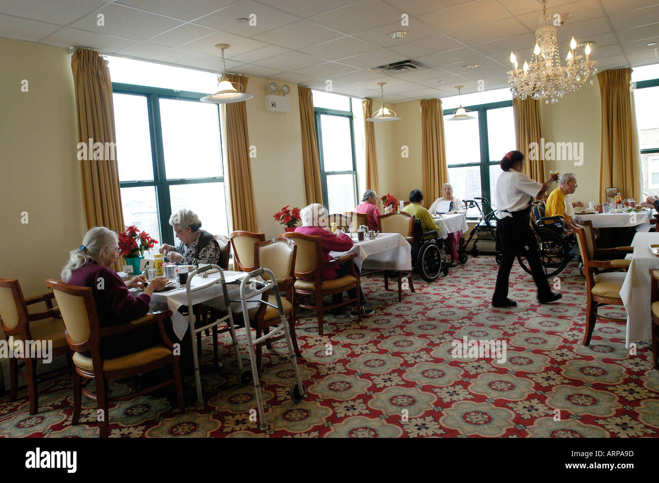 Residents have lunch at the Lott Assisted Living residence Stock Photo
