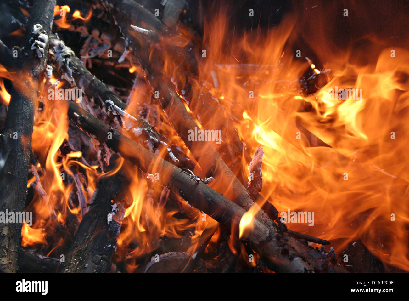 Flames burn and wood embers glow Stock Photo