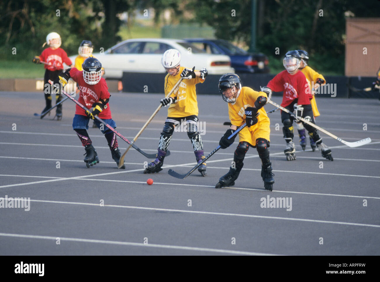 Roller hockey or street hockey, youth league, proper safety gear, sports Ohio USA skates playground Stock Photo
