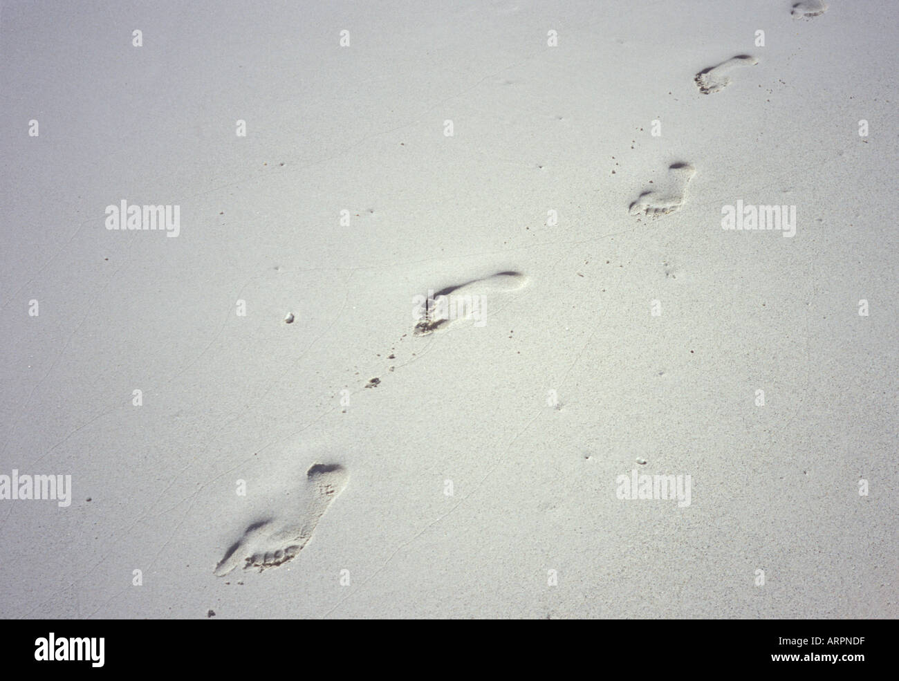 Footprints on the sand Stock Photo