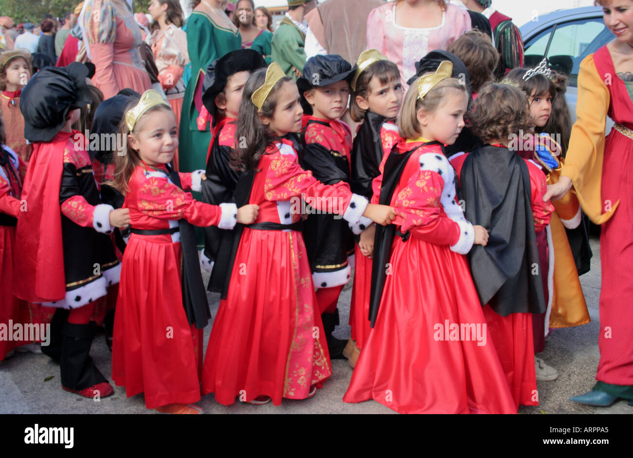 children dressed in historic red costumes at  Parade Festival dos Descobrimentos Lagos Algarve Portugal Stock Photo