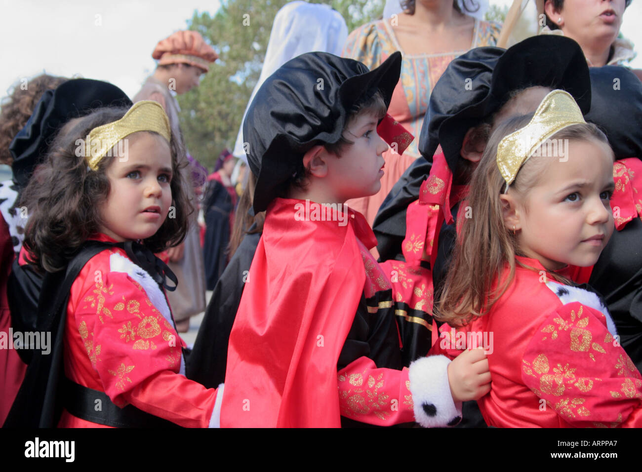 children dressed in historic red costumes at  Parade Festival dos Descobrimentos  Lagos Algarve Portugal Stock Photo