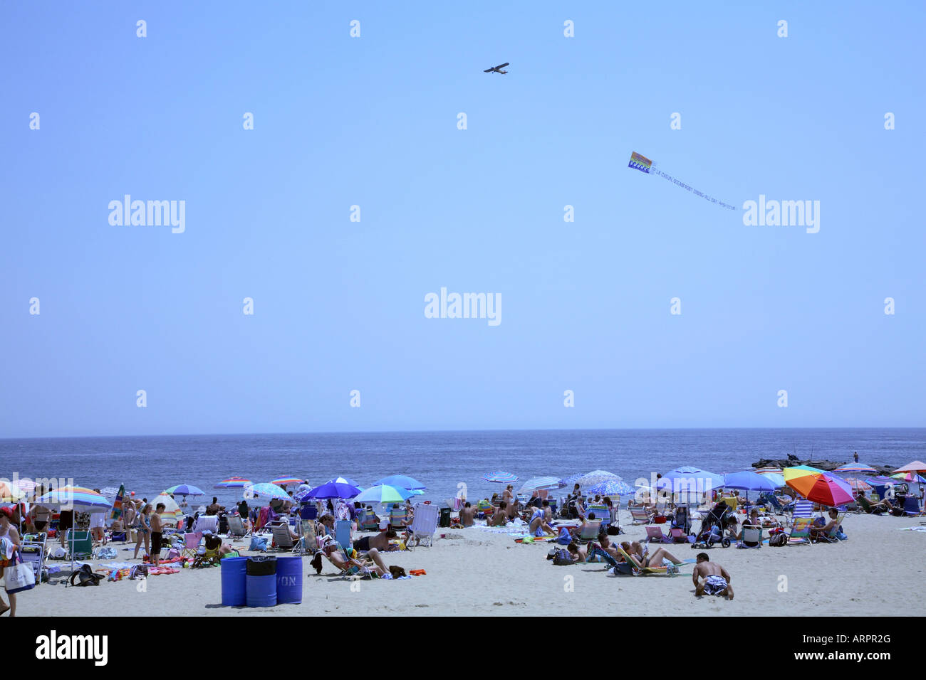 Advertising to the masses at the shore. Stock Photo