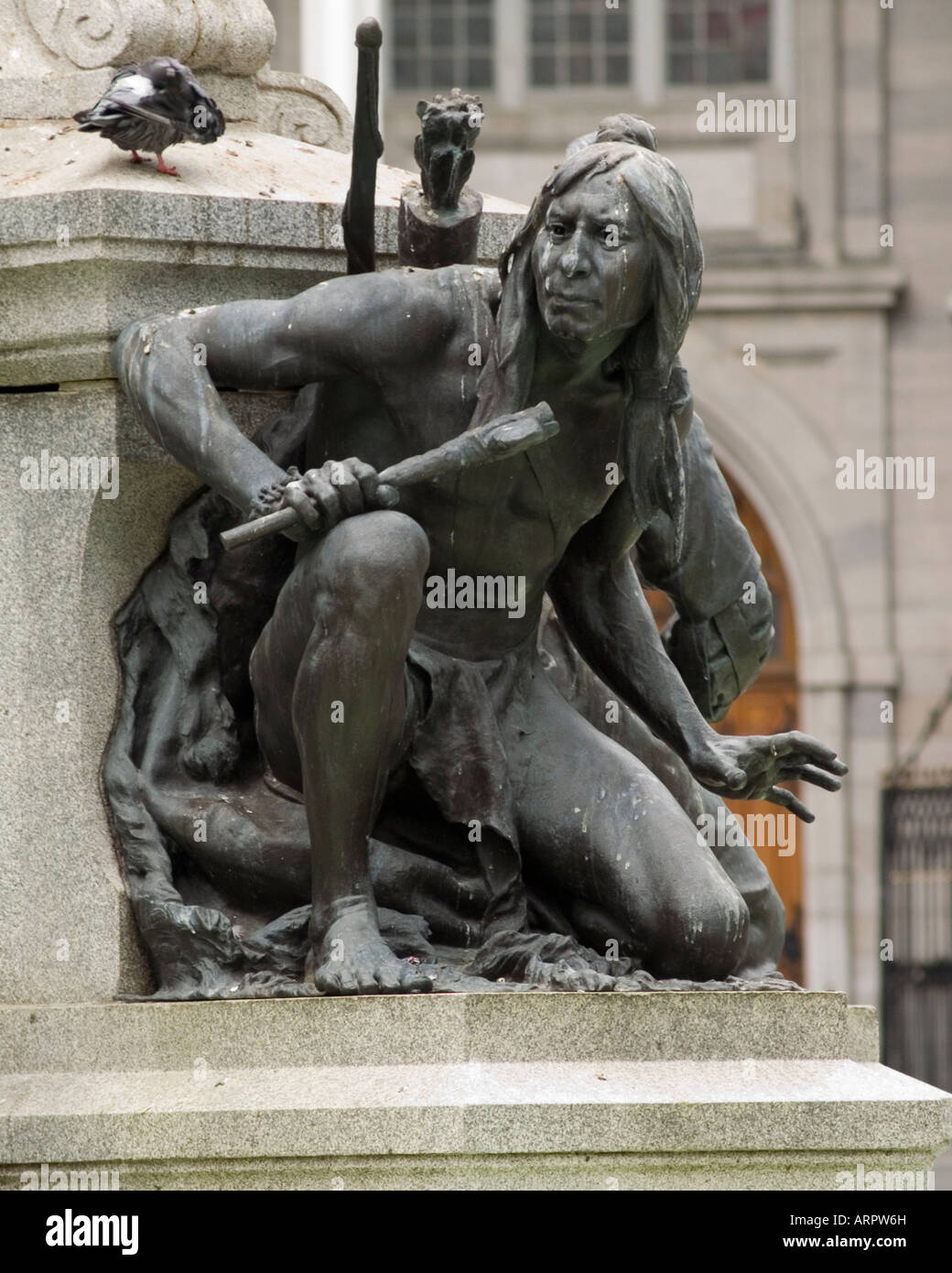 Close up on a statue of an Iriquois Brave on a fountain in Place D'Arms, Vieux Montreal Quebec Canada Stock Photo
