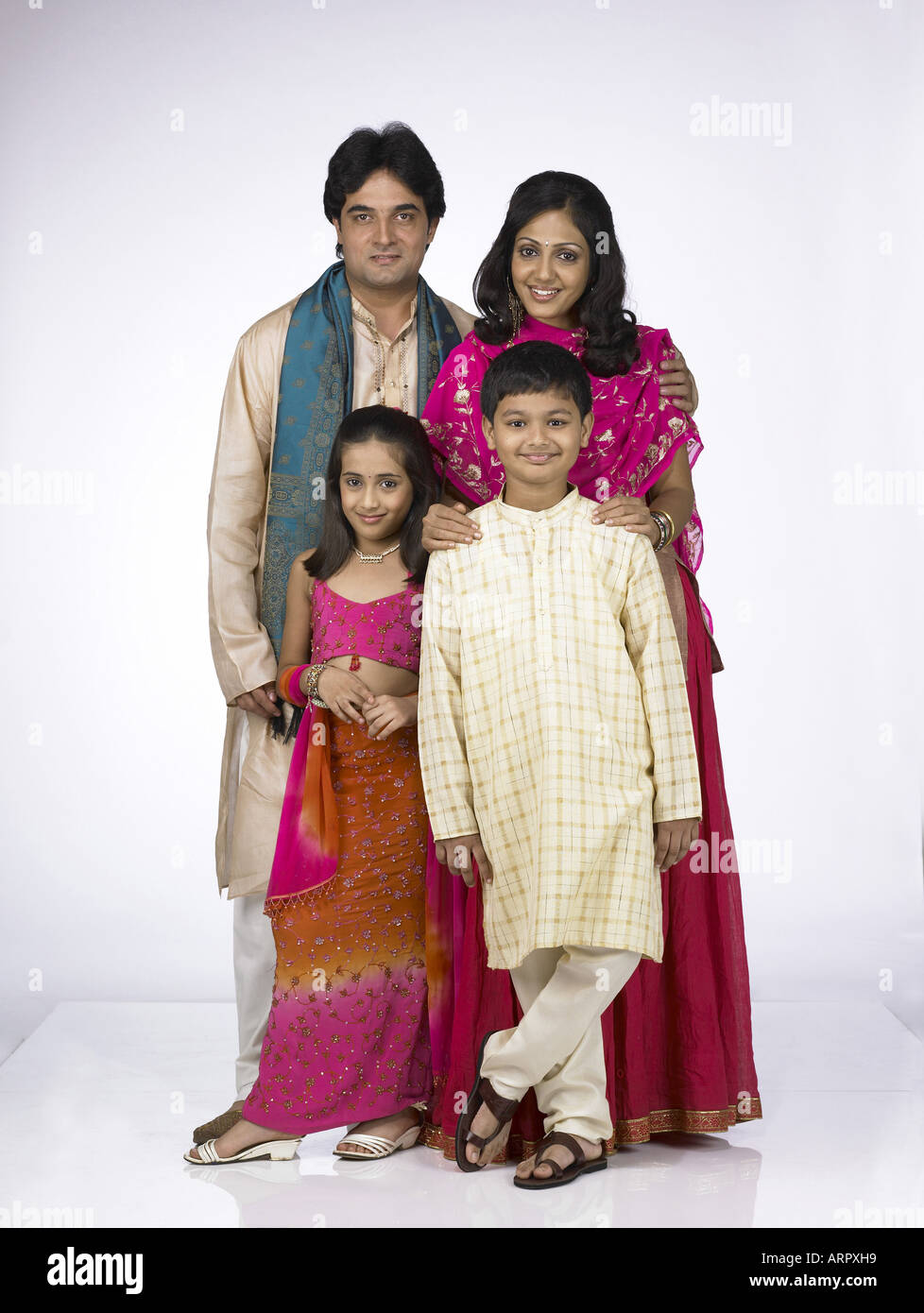 South Asian Indian family with father mother son and daughter ...