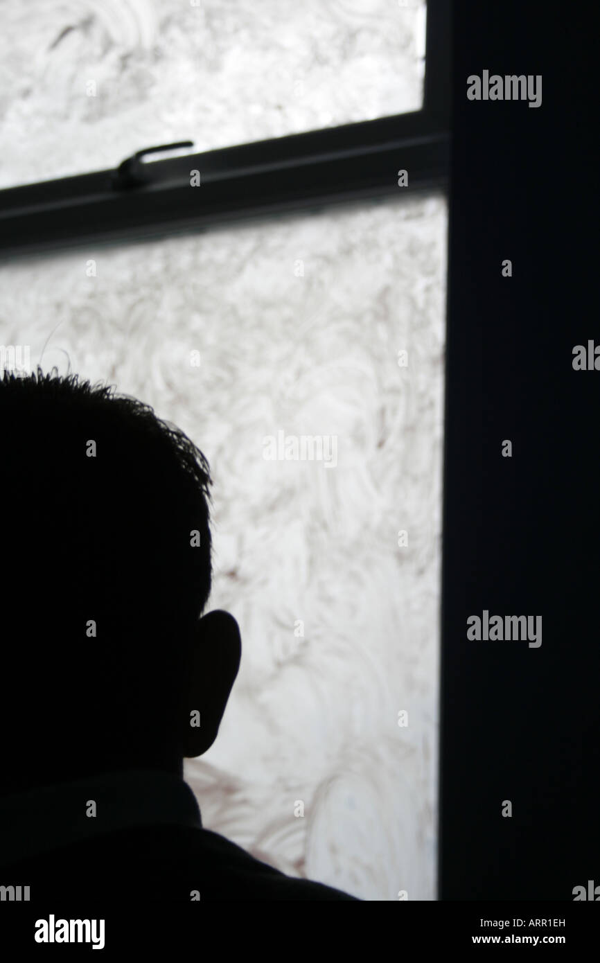 man sitting in dark room Stock Photo Alamy