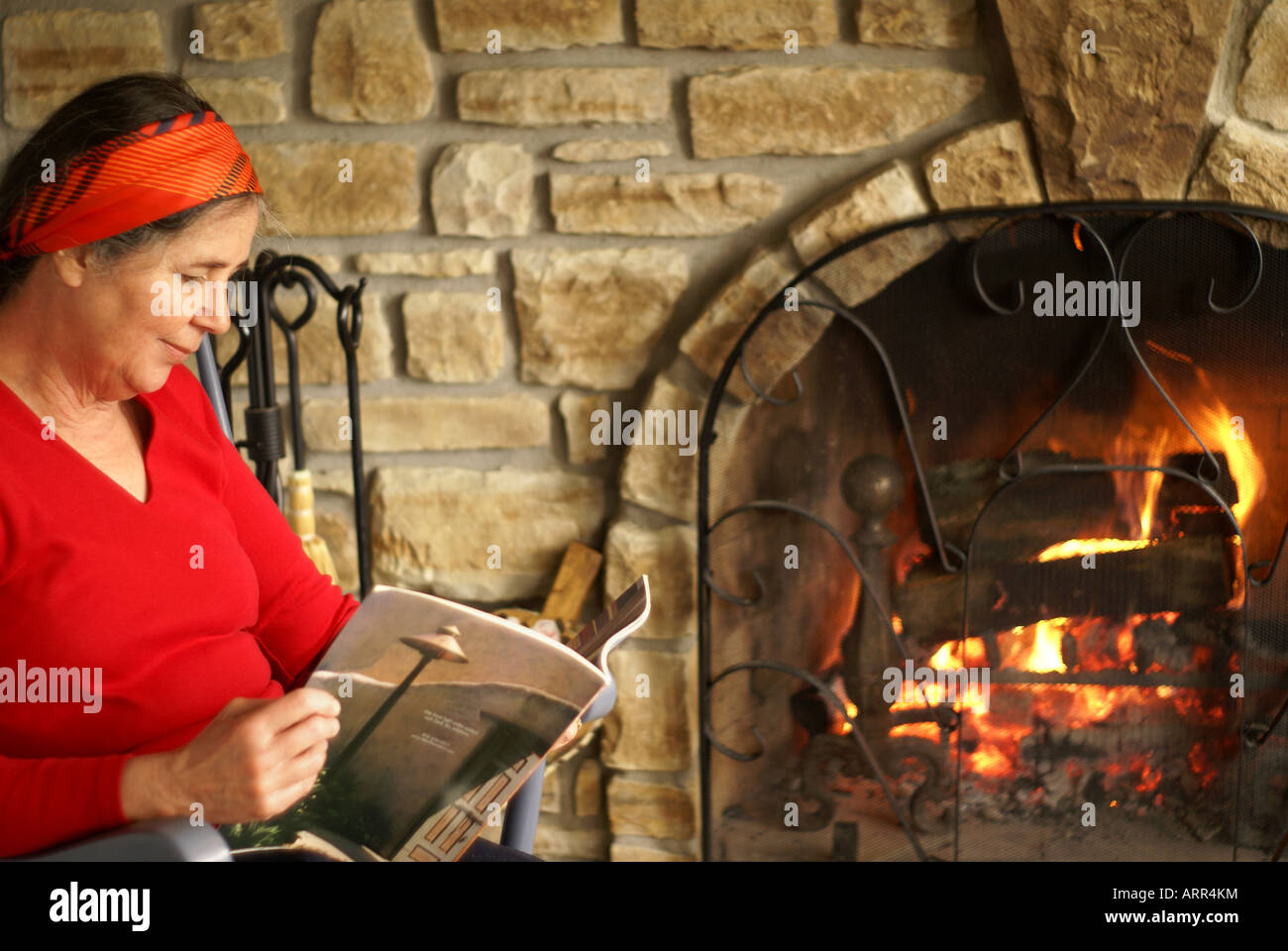Reading By Fireplace Stock Photo Alamy