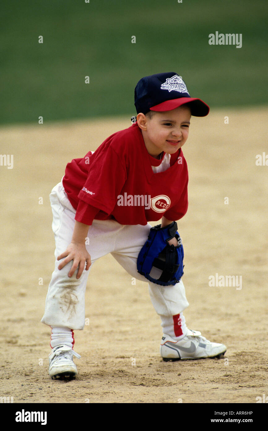 Young boy at short stop during a tee ball game Stock Photo Alamy