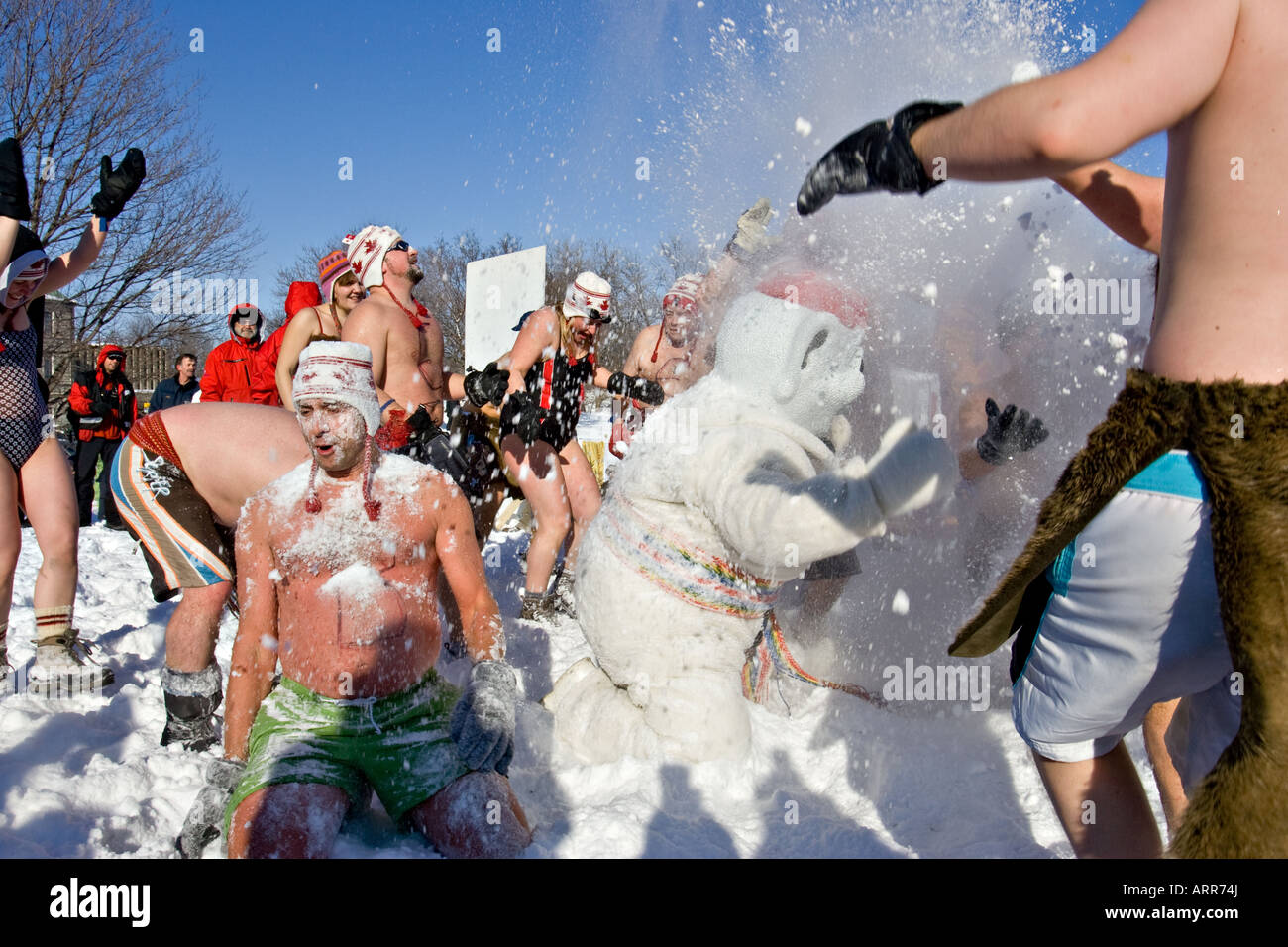 Carnival goers have fun with Bohomme Carnaval during the annual Snow Bath Stock Photo