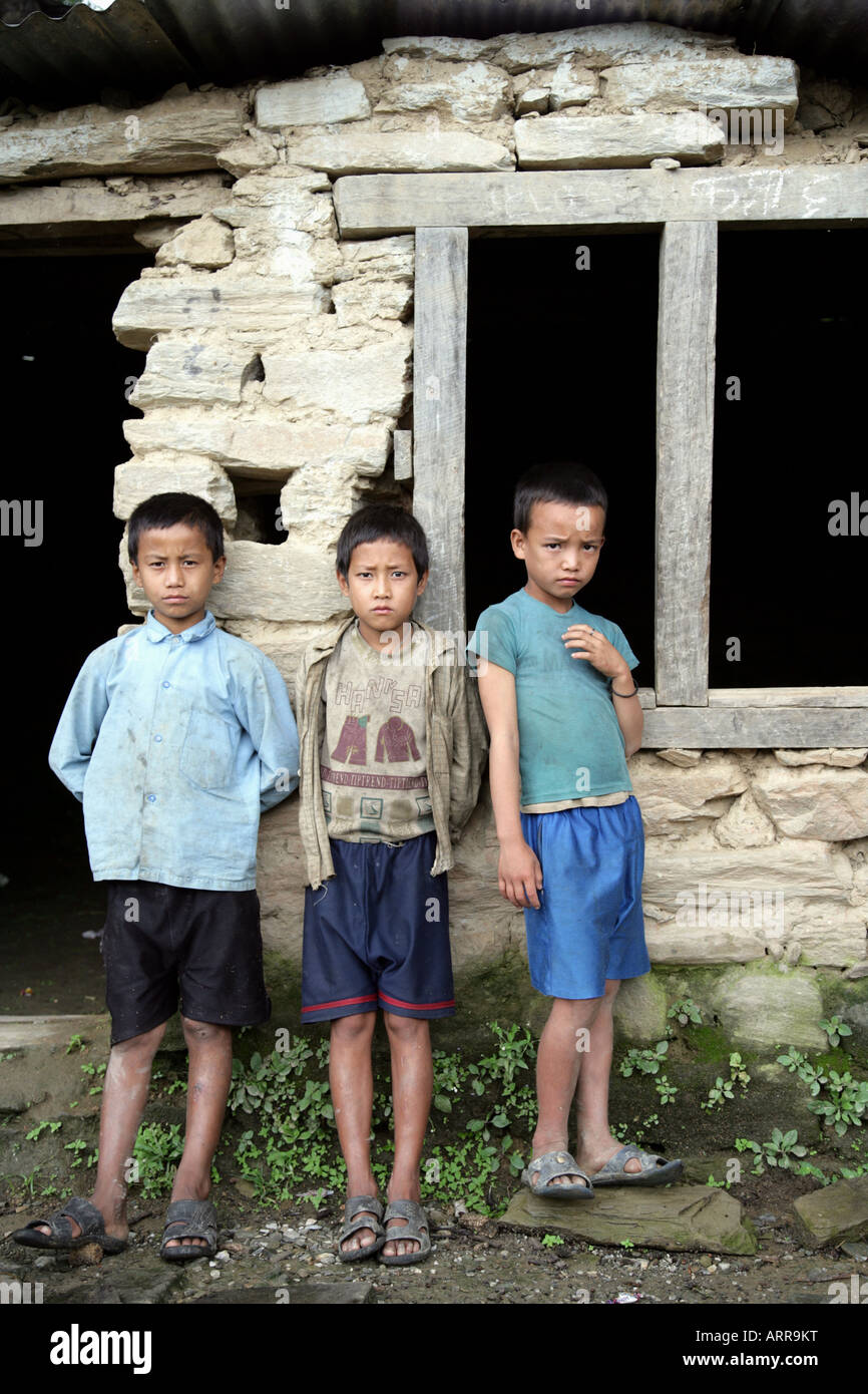 Three boys at derilict school building Stock Photo