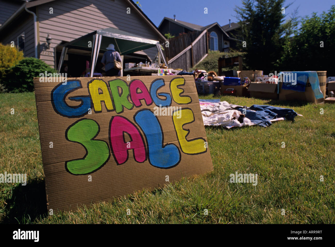 Residential neighborhood family is having a garage sale in their front