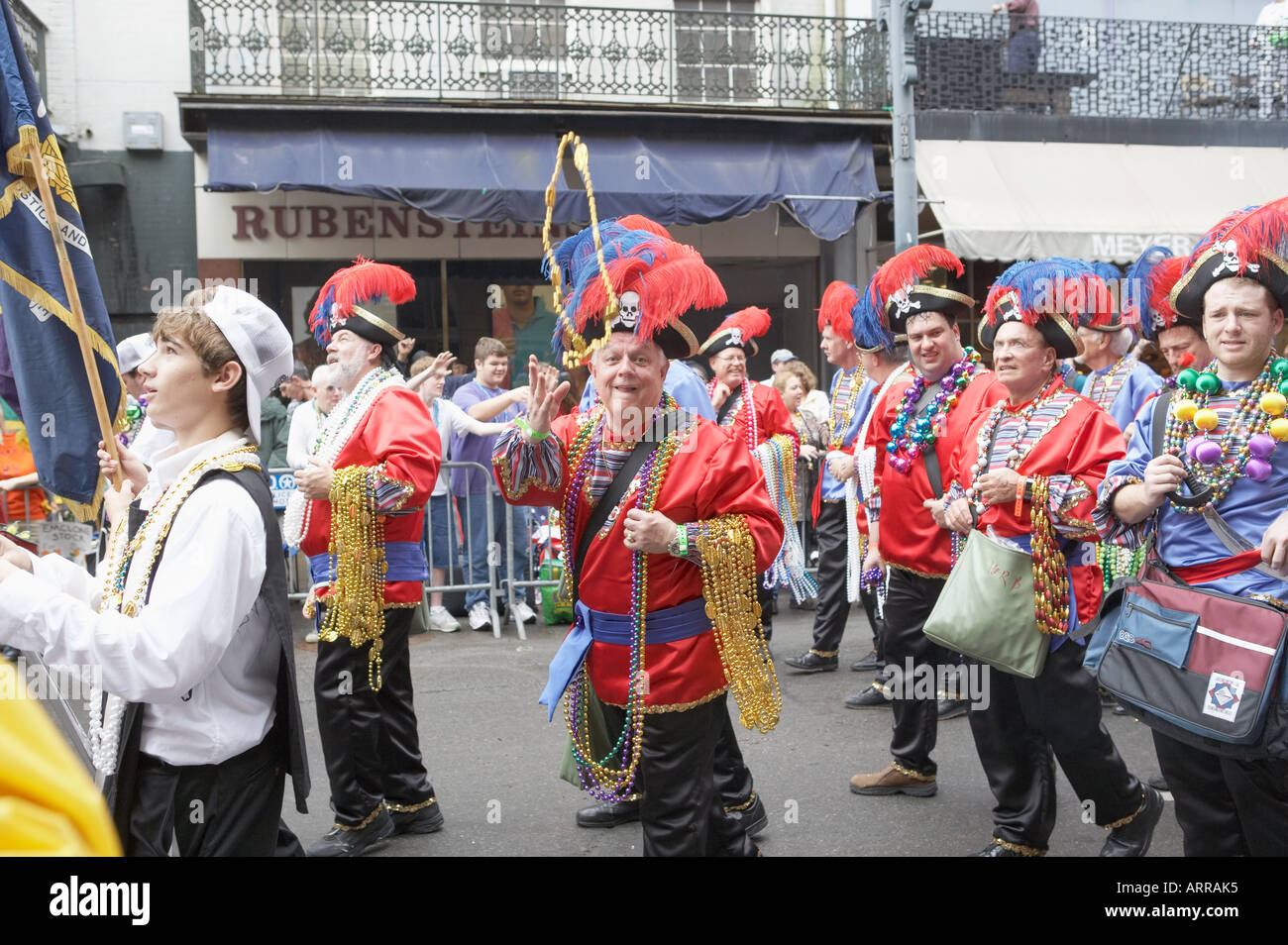 Mardi Gras participant throwing beads, main parade, on Fat Tuesday, New