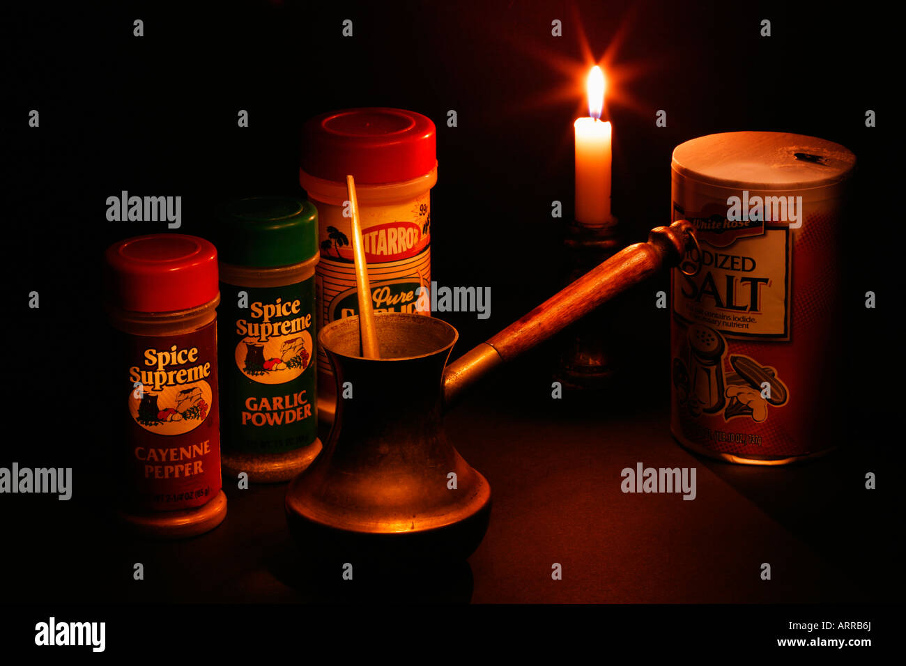 Still life with pepper, salt and other species. Artistic vision. Candle