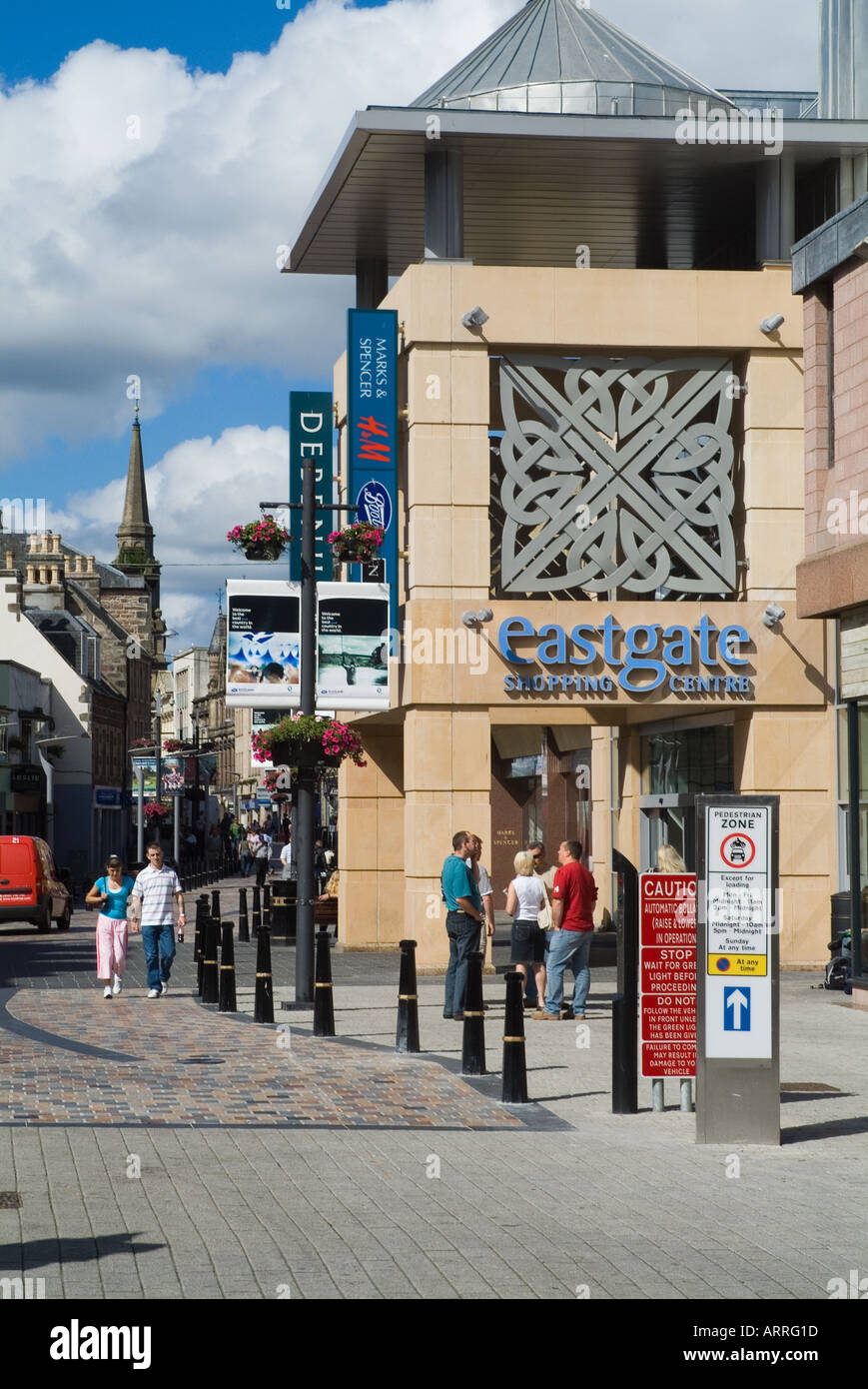 dh Eastgate INVERNESS INVERNESSSHIRE People in High Steet entrance to Eastgate shopping centre mall street city Stock Photo