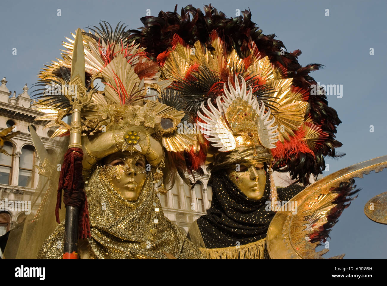 Two Carnival Venetian disguises of warrior with shield and spear Stock Photo