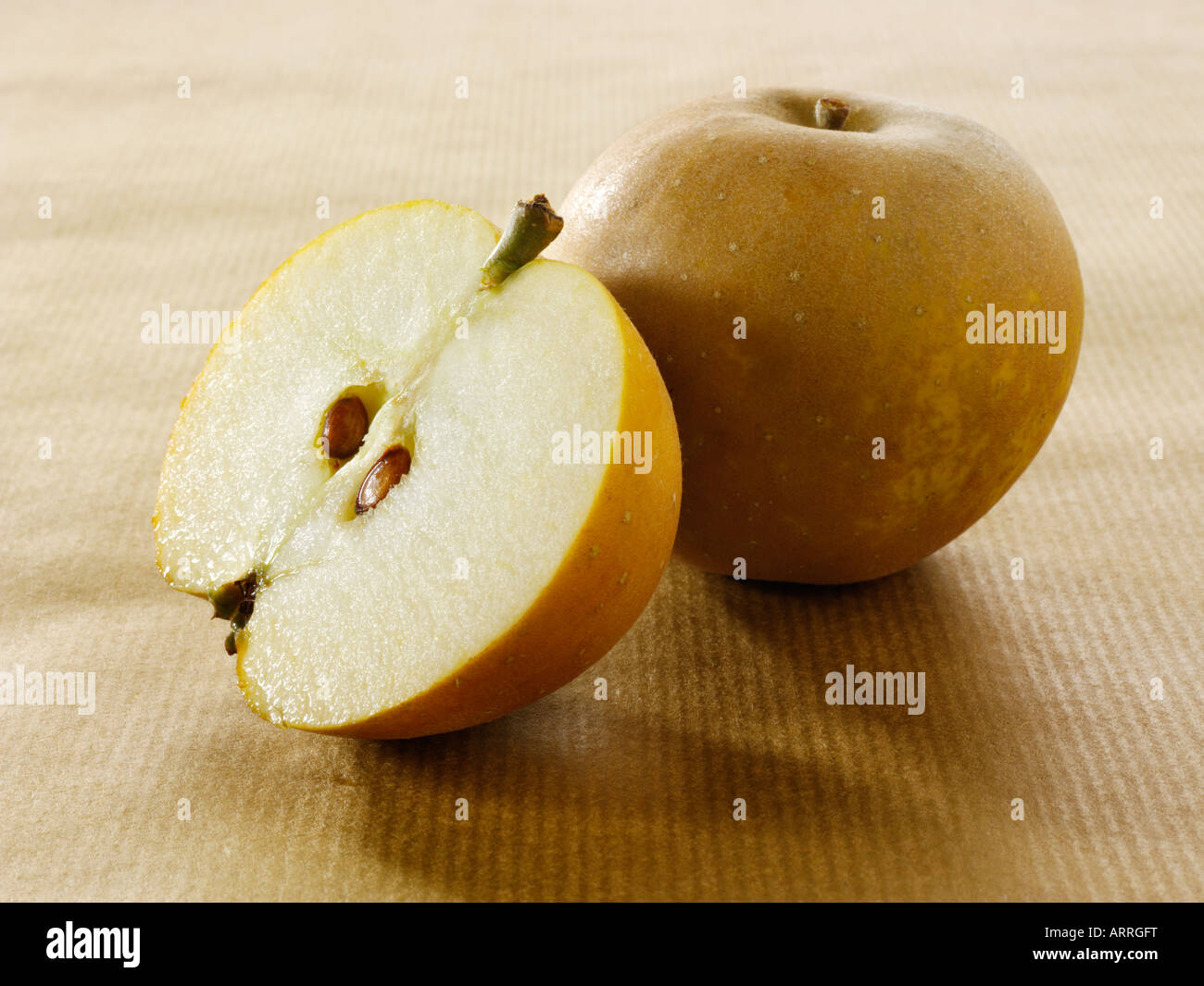 English Russet apple - whole and cut Stock Photo