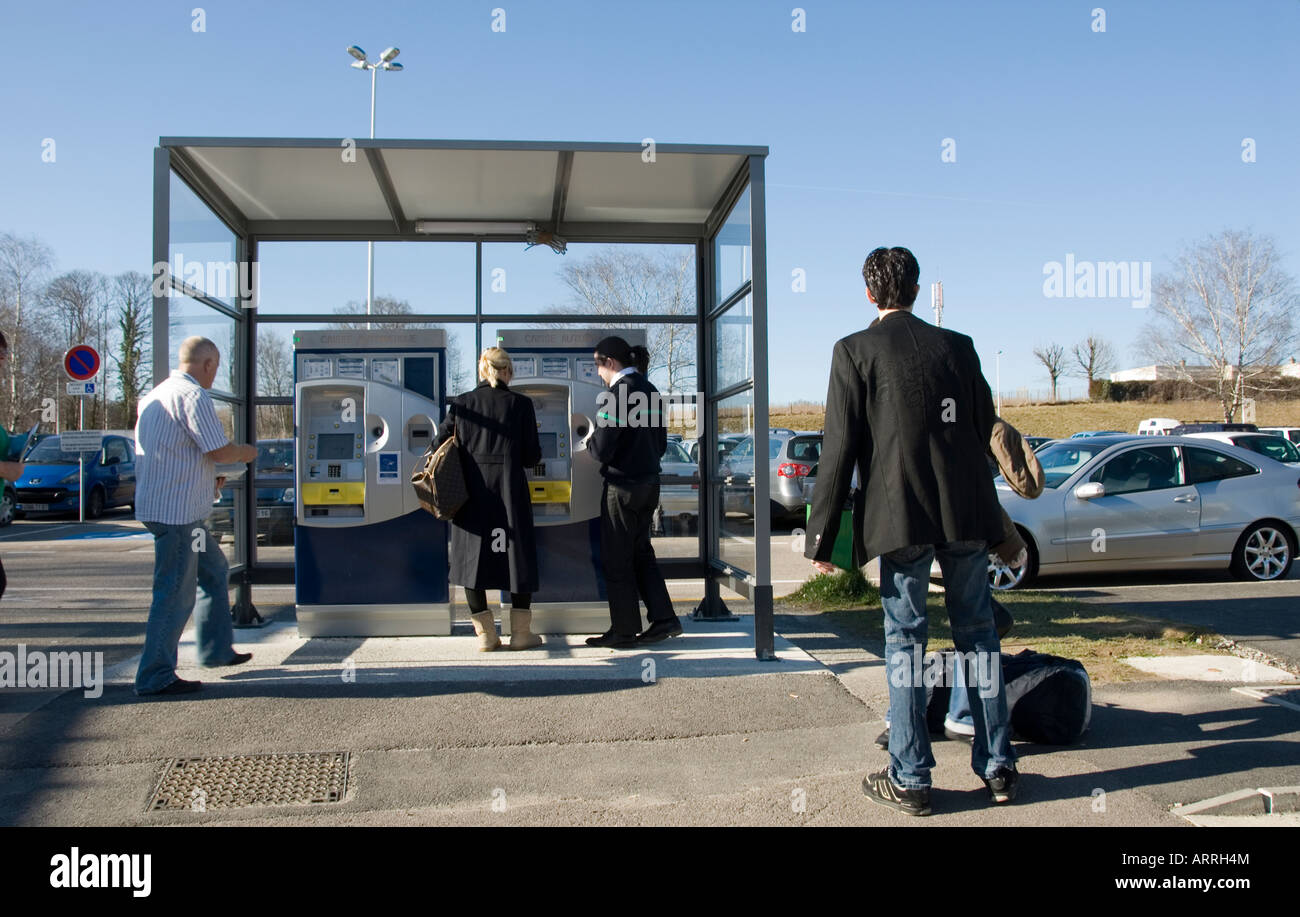 People queueing to pay for their car park tickets at an automated ...