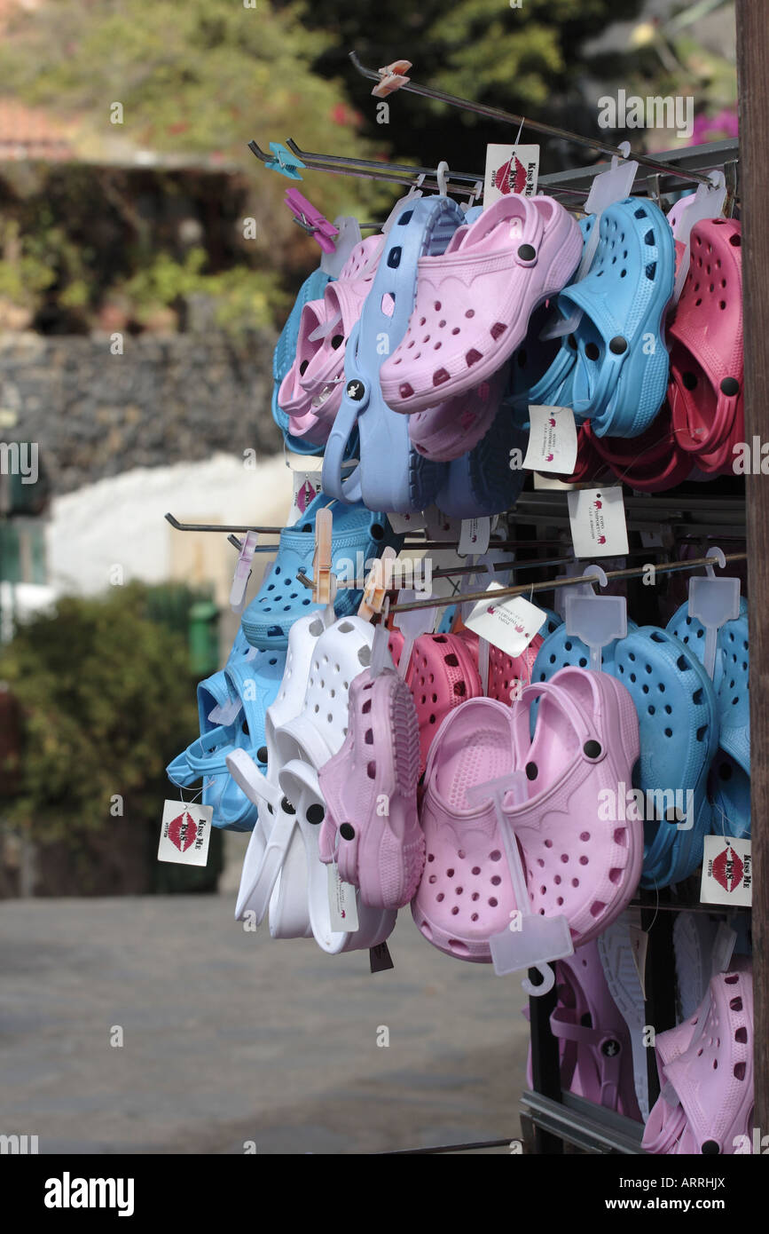 Croc style shoes on a rack outside a souvenir shop in Masca Tenerife Canary Islands Spain Stock Photo