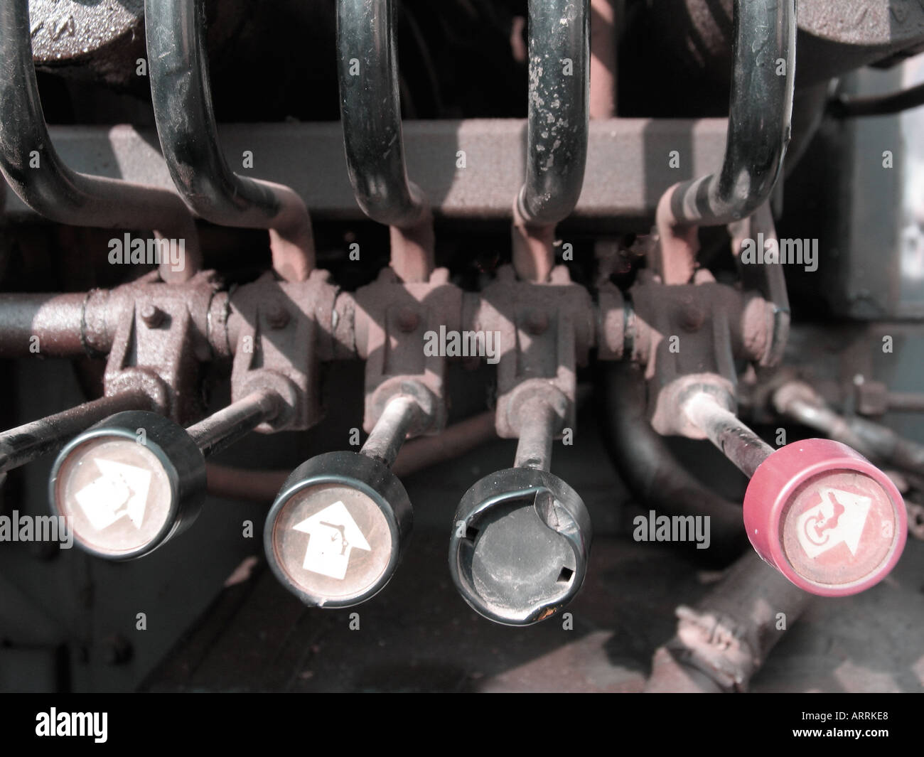 Arrows on machinery levers Stock Photo