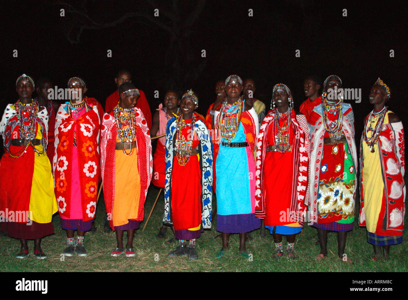 Masai women at night in traditional dress Masai Mara National Nature Reserve Kenya East Africa Stock Photo